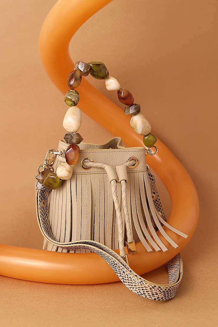 Beige Leather Fringed Boho Bucket Bag by And Also at Pernia's Pop Up Shop