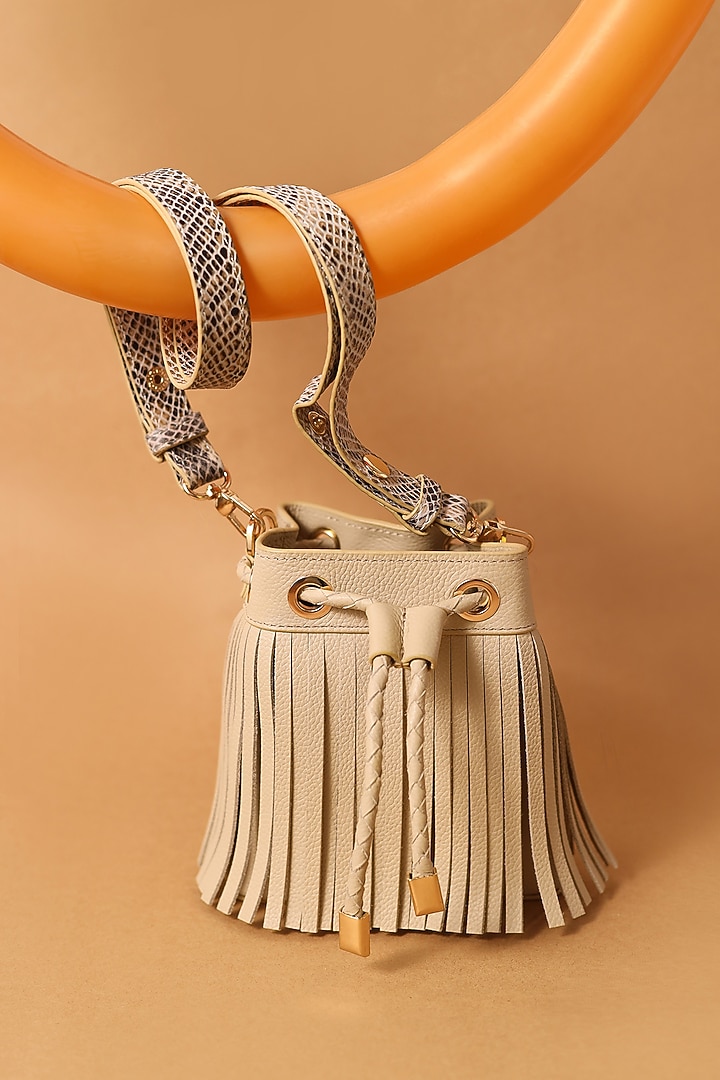 Beige Leather Fringed Boho Bucket Bag by And Also at Pernia's Pop Up Shop