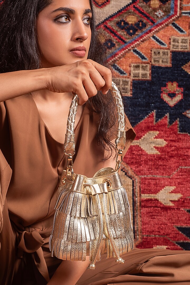 Gold Leather Fringes Bucket Bag by And Also at Pernia's Pop Up Shop