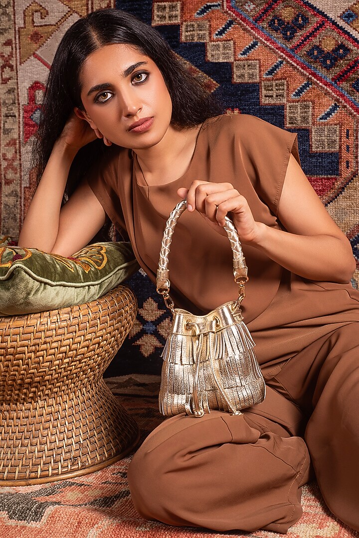 Gold Leather Fringes Bucket Bag by And Also at Pernia's Pop Up Shop
