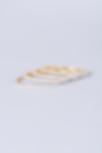 Gold Finish Zircons Bangles (Set of 4) by Anjali Jain Jewellery at Pernia's Pop Up Shop