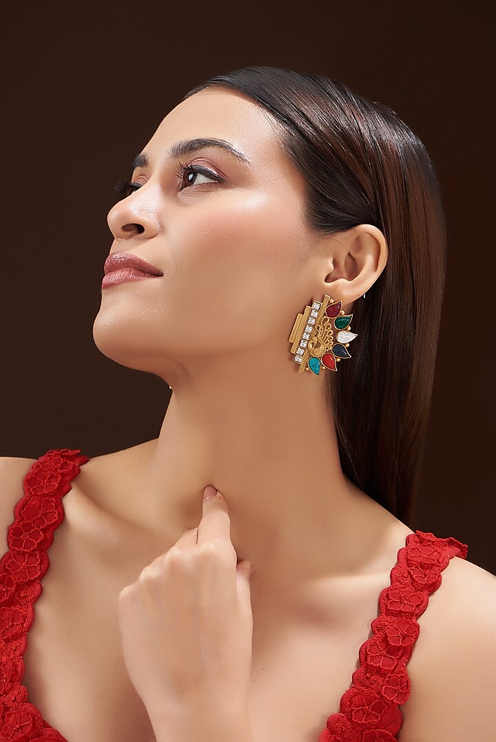 Gold Finish Navratna Stone Stud Earrings by Anjali Jain Jewellery