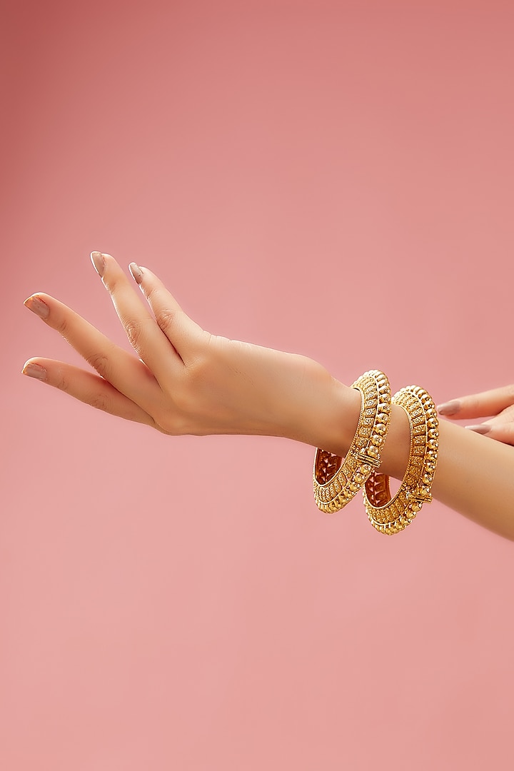 Gold Plated Carved Temple Bangles (Set of 2) by Anjali Jain Jewellery