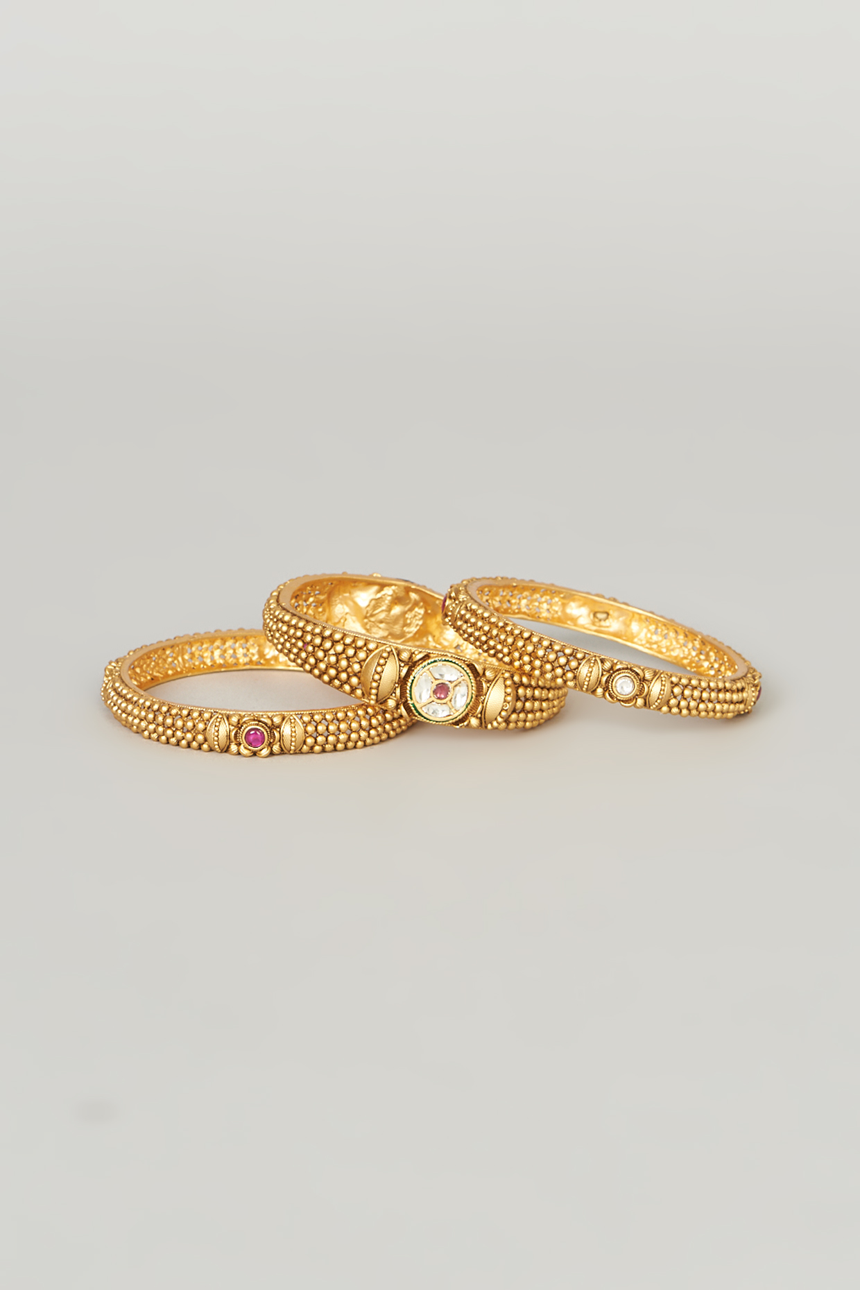 Gold Finish Red Stone Bangle (Set of 3) by Anjali Jain Jewellery at Pernia's Pop Up Shop