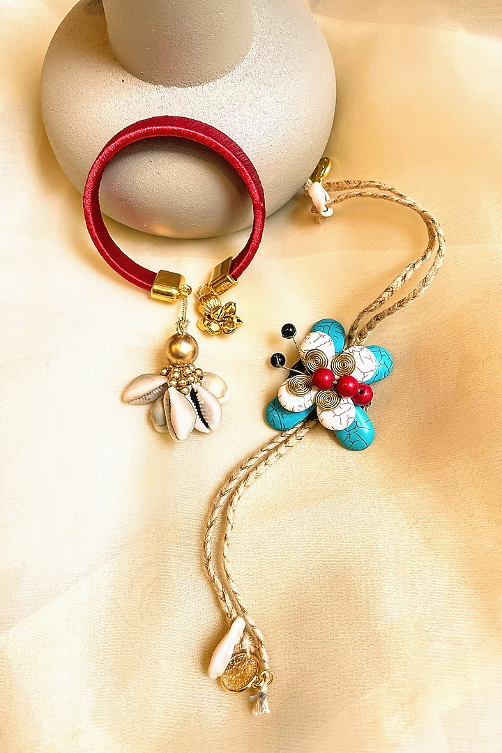 Red & Blue Floral Rakhi & Lumba (Set of 2) by Anjali Jain Jewellery at Pernia's Pop Up Shop