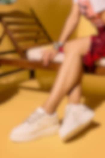 White Faux Leather Sneakers by Anaar at Pernia's Pop Up Shop