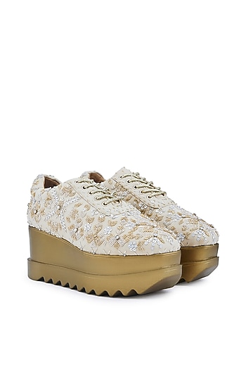 Off-White Striped Chiffon Cutdana Embellished Wedge Sneakers by Anaar at Pernia's Pop Up Shop