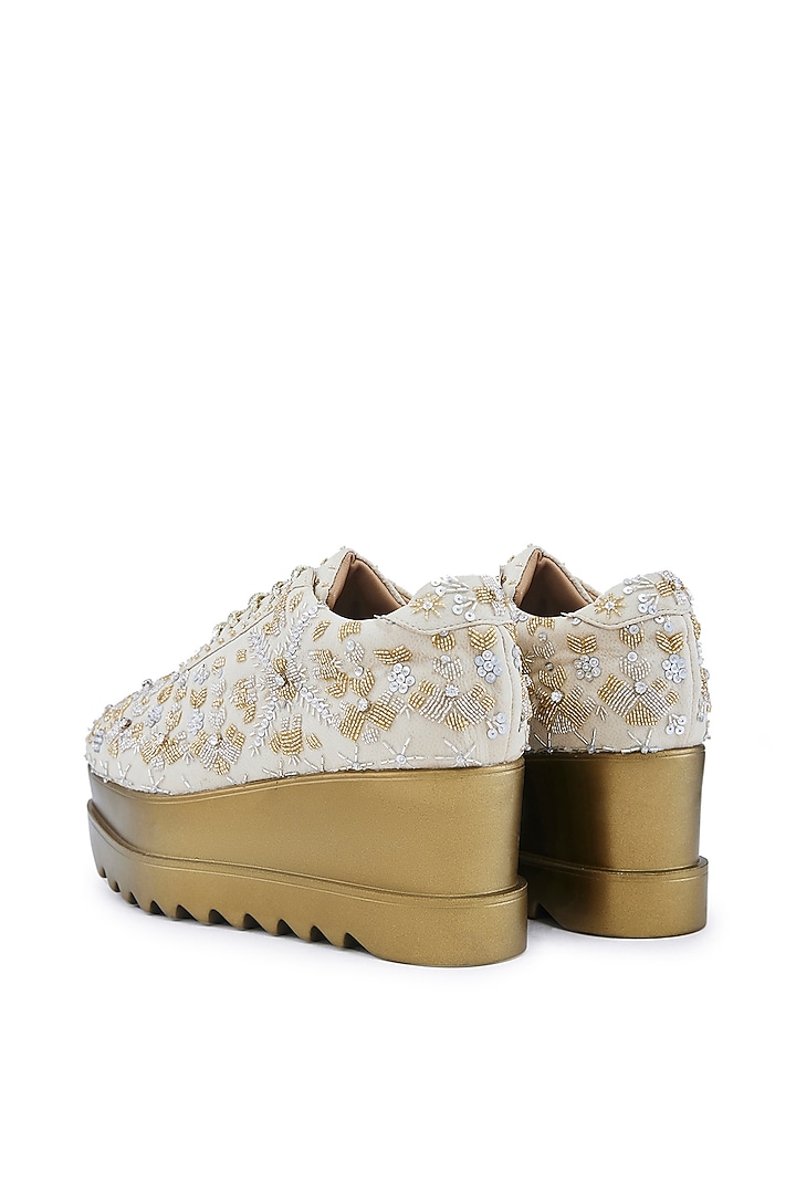 Off-White Striped Chiffon Cutdana Embellished Wedge Sneakers by Anaar at Pernia's Pop Up Shop