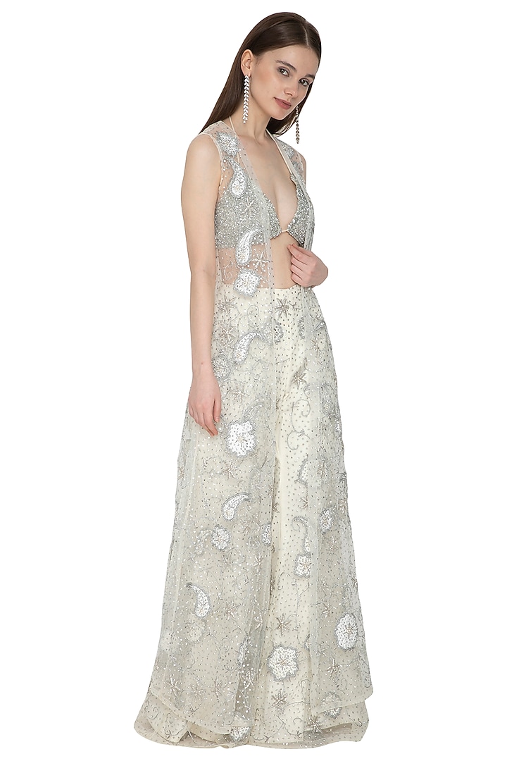 Off White Embroidered Bikini Blouse With Flared Pants & Cape by Ank By Amrit Kaur at Pernia's Pop Up Shop