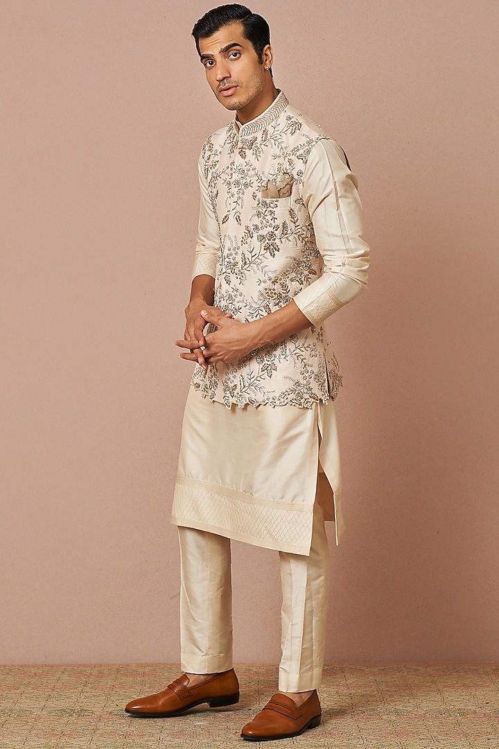 Ivory Raw Silk Embroidered Bundi Jacket With Kurta Set by Anushree Reddy Men