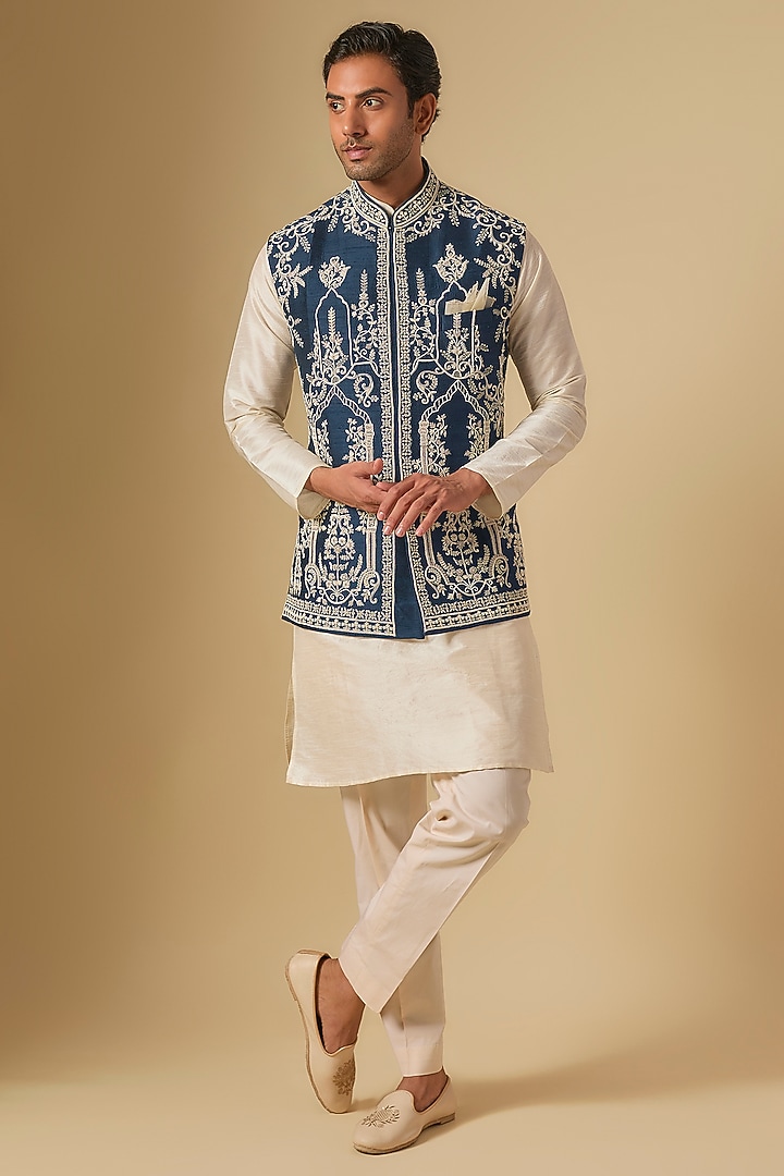 Midnight Blue & Ivory Raw Silk Embroidered Bundi Jacket by Anushree Reddy Men at Pernia's Pop Up Shop