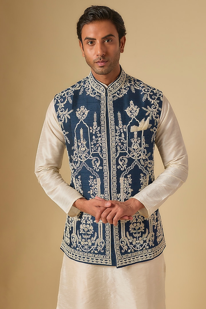 Midnight Blue & Ivory Raw Silk Embroidered Bundi Jacket by Anushree Reddy Men at Pernia's Pop Up Shop