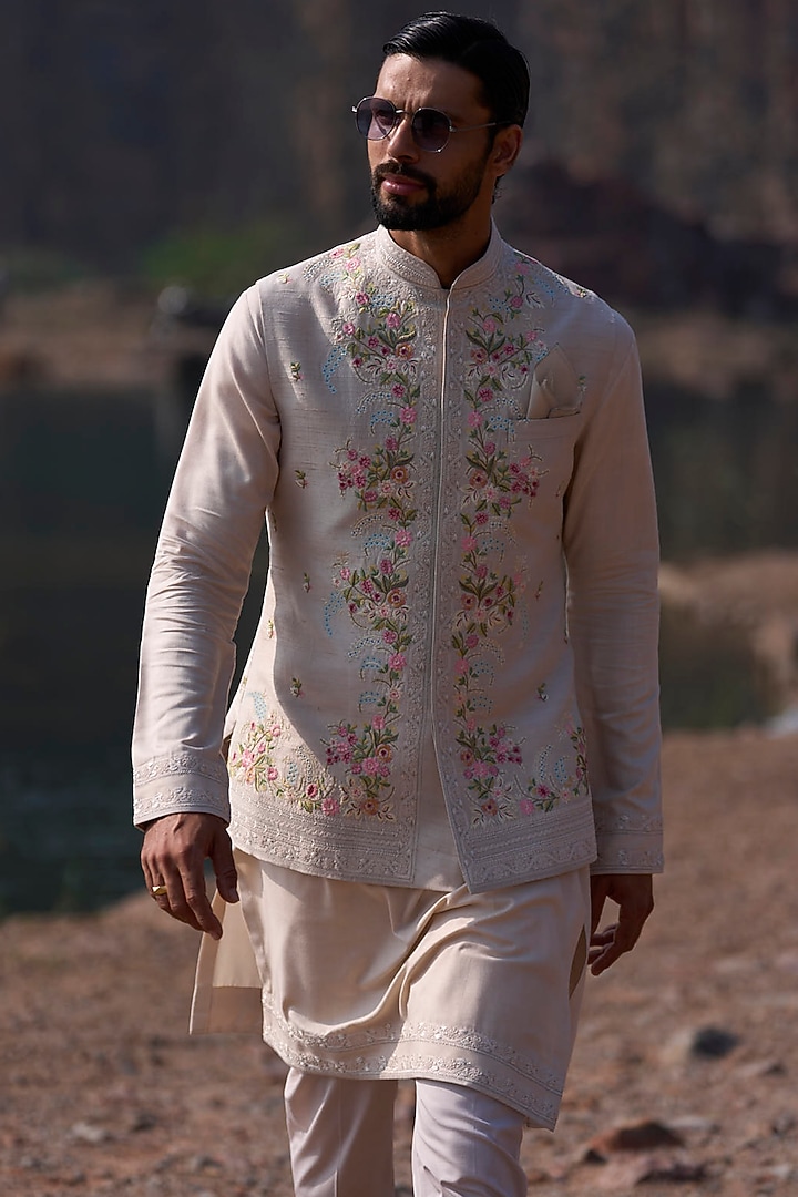 Ivory Raw Silk Thread Embroidered Bundi Jacket Set by Anushree Reddy Men at Pernia's Pop Up Shop