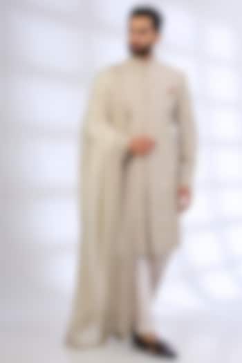 Dull Ivory Raw Silk Groom Sherwani Set by Anushree Reddy Men at Pernia's Pop Up Shop