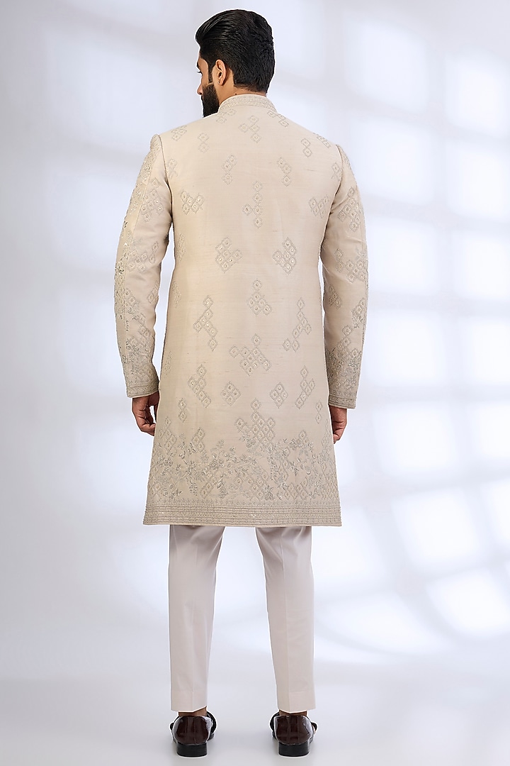 Dull Ivory Raw Silk Groom Sherwani Set by Anushree Reddy Men at Pernia's Pop Up Shop