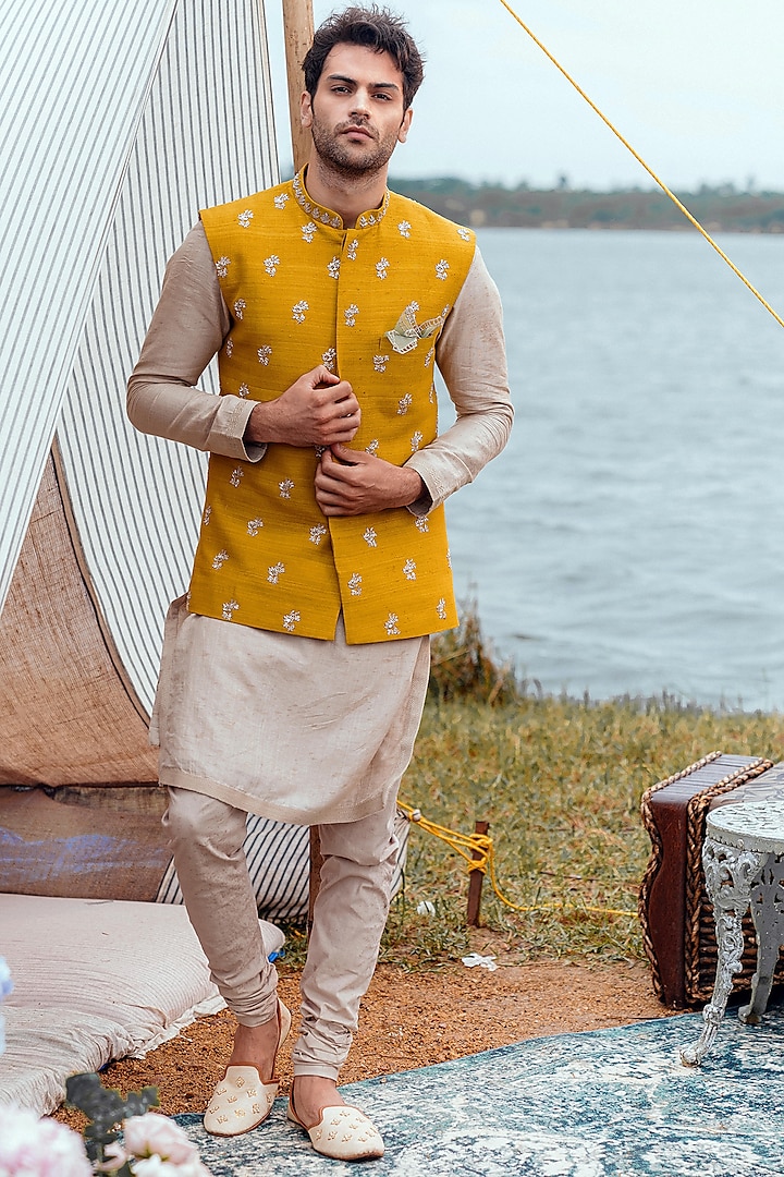 Beige Kurta Set With Mustard Bundi Jacket by Anushree Reddy Men