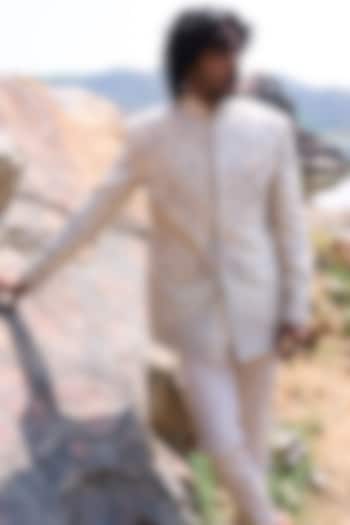 Ivory Raw Silk Thread Embroidered Groom Bandhgala Set by Anushree Reddy Men at Pernia's Pop Up Shop