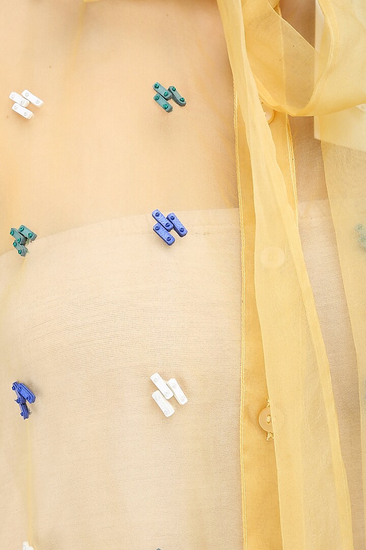 Yellow, blue, green and white sequinned motifs shirt available only at Pernia's Pop Up Shop.
