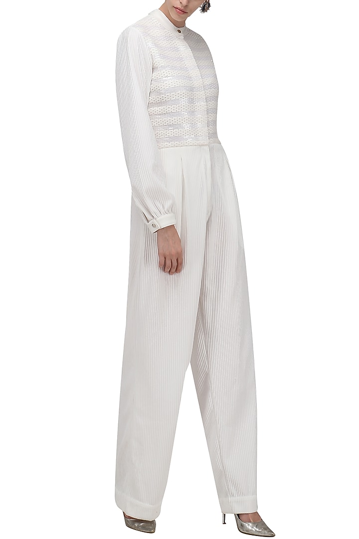 White knitted jumpsuit available only at Pernia's Pop Up Shop.