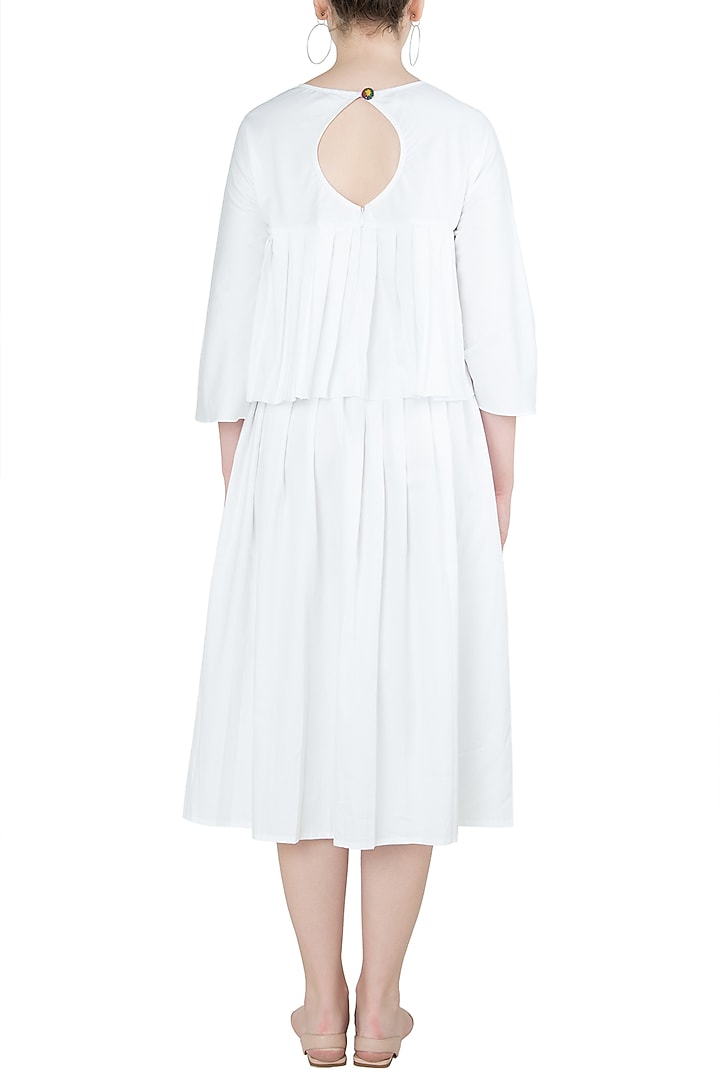 White A-line pleated midi skirt available only at Pernia's Pop Up Shop.