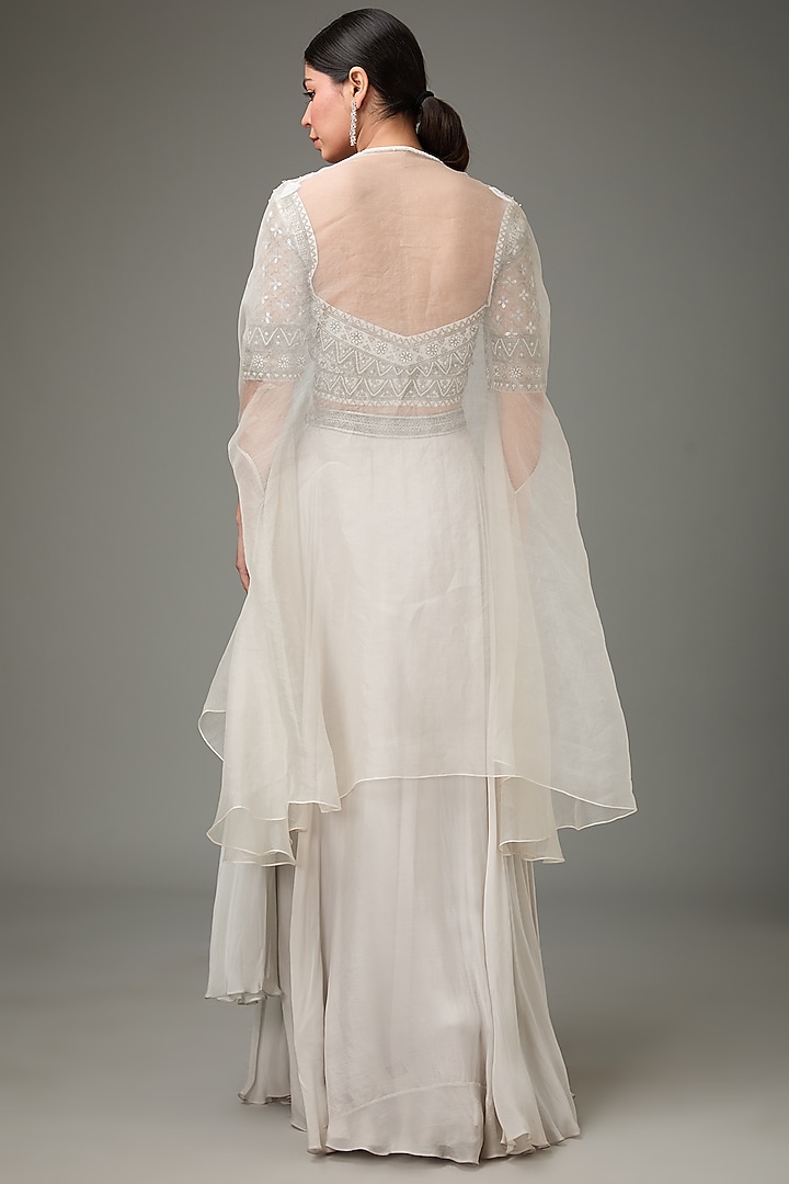 Ivory Flat Chiffon Embellished Layered Cape Wedding Lehenga Set by ANJALIVERMA at Pernia's Pop Up Shop