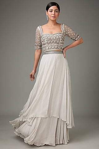 Ivory Flat Chiffon Embellished Layered Cape Lehenga Set by ANJALIVERMA