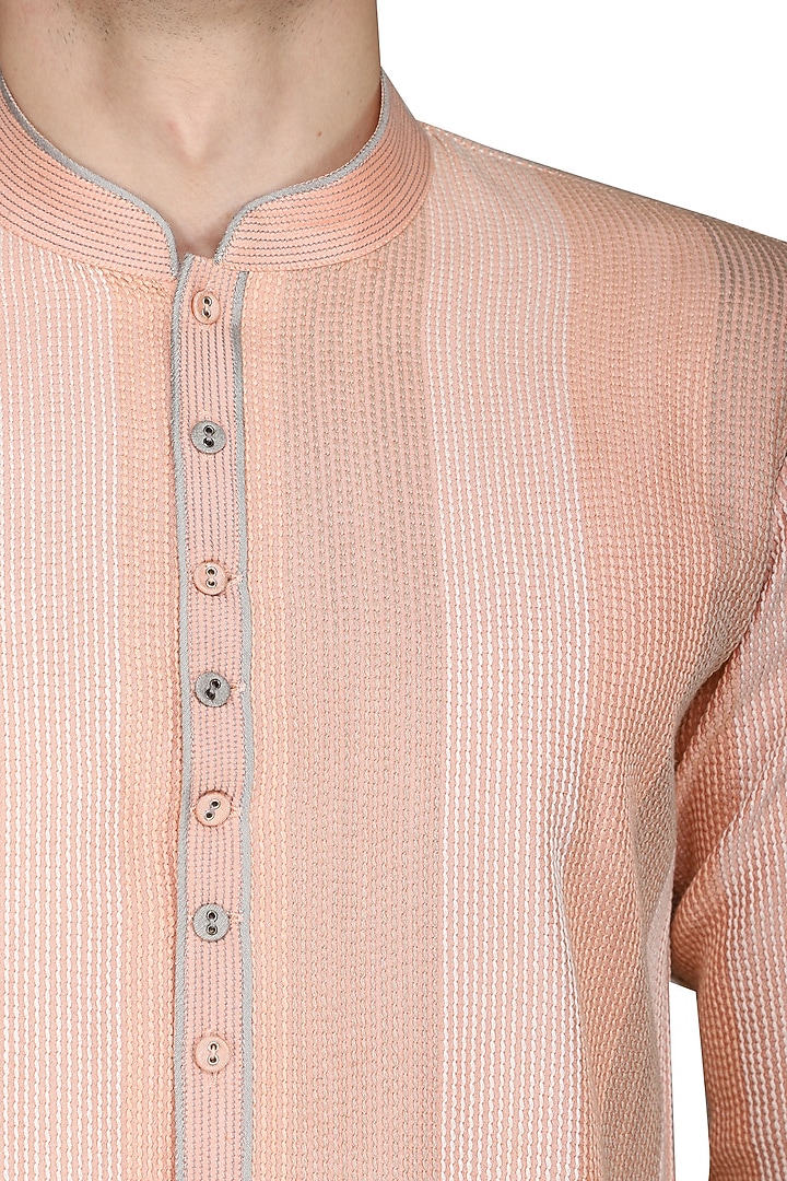 Peach thread work kurta with ivory churidar pants available only at Pernia's Pop Up Shop.