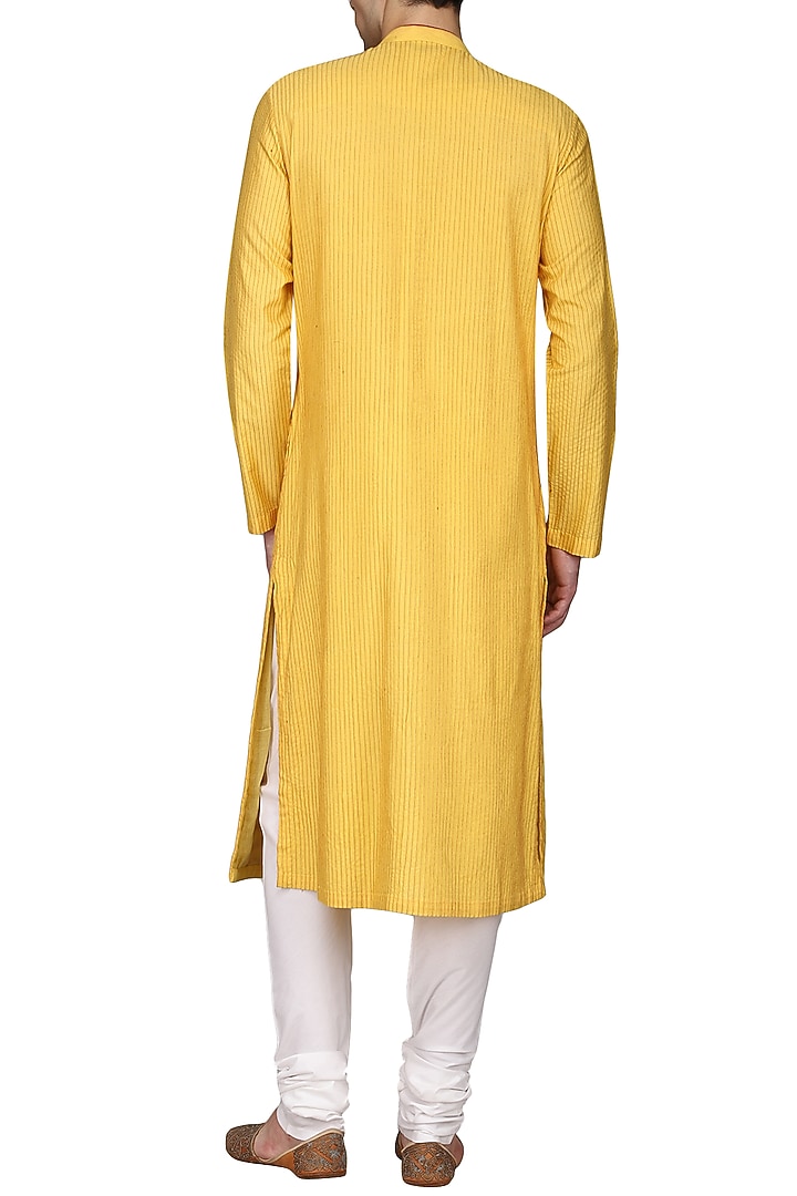 Yellow pintucks kurta with ivory churidar pants available only at Pernia's Pop Up Shop.