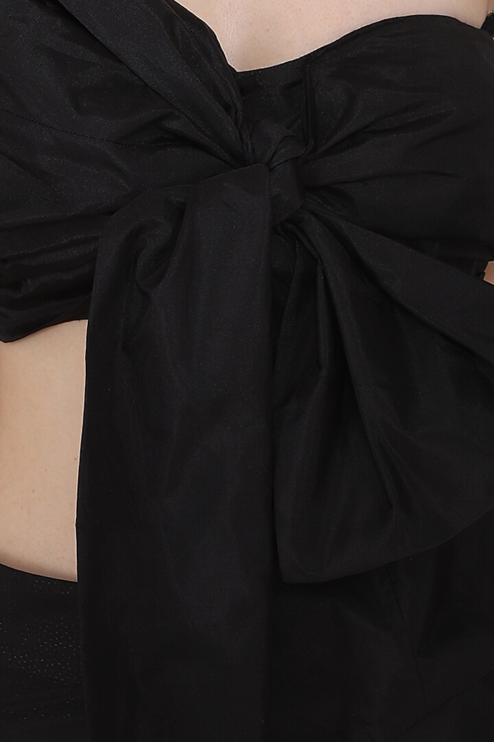 Black bow blouse with ruffle lehenga skirt available only at Pernia's Pop Up Shop.