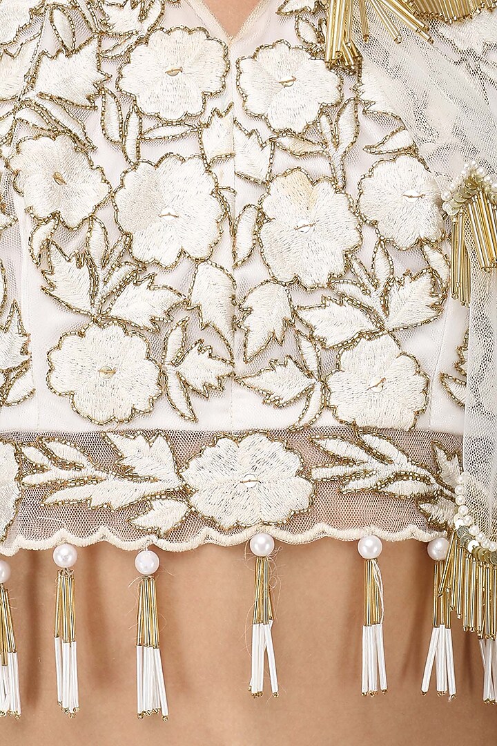 White zardozi embroidered tasseled crop top with cape and skirt set available only at Pernia's Pop Up Shop.