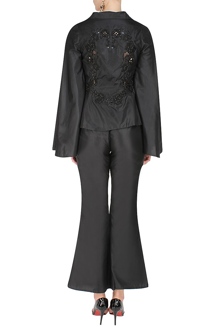 Black floral sequins and cutdana embroidered coat and flared pants set available only at Pernia's Pop Up Shop.