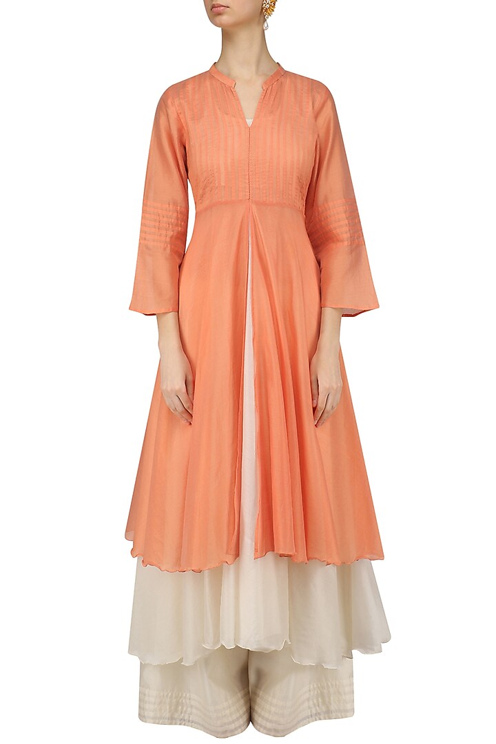 Pale orange pintuck kurta and off white palazzo pants set available only at Pernia's Pop Up Shop.