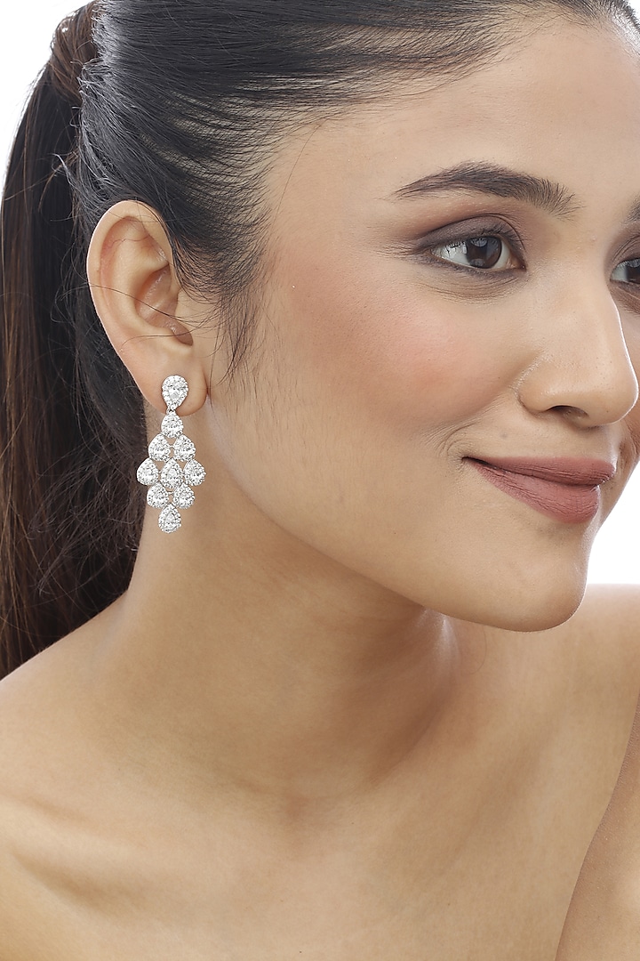 White Finish Pear-Shaped Swarovski Stone Dangler Earrings In Sterling Silver by Tesoro by Bhavika at Pernia's Pop Up Shop