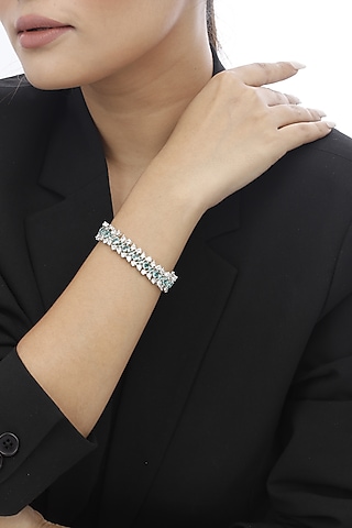 White Finish Swarovski & Aquamarine Stone Bracelet In Sterling Silver by Tesoro by Bhavika