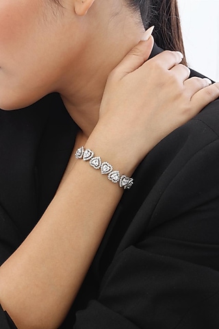 White Finish Swarovski Stone Heart-Shaped Tennis Bracelet In Sterling Silver by Tesoro by Bhavika