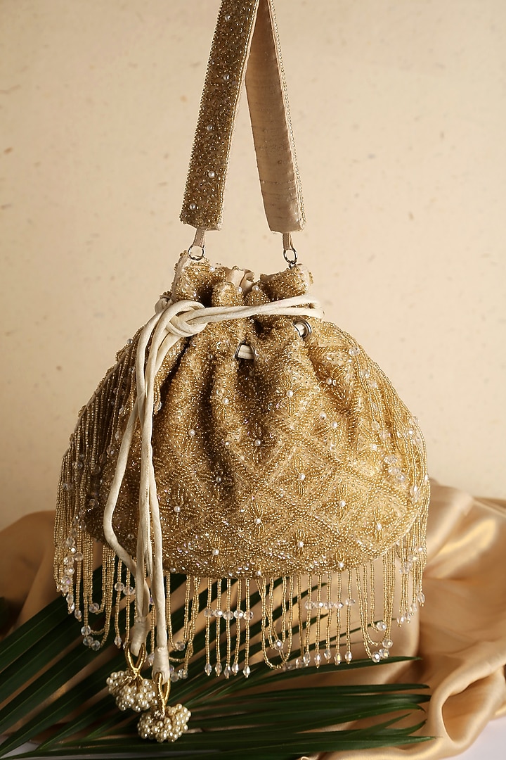Gold Raw Silk Embellished Potli by Ara Studio at Pernia's Pop Up Shop
