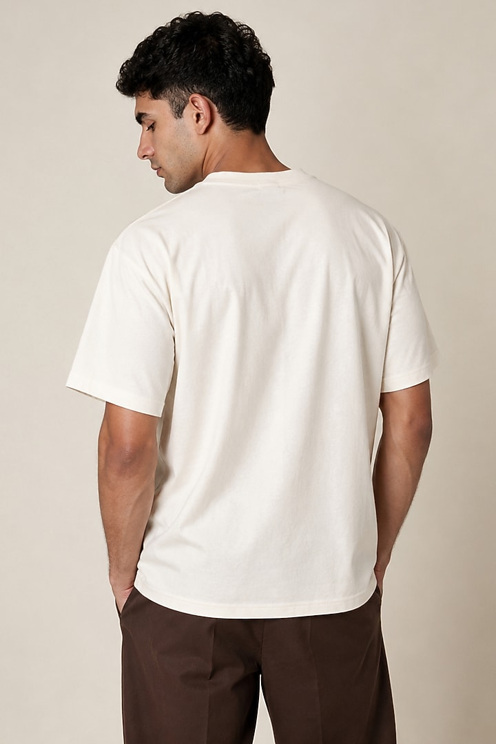 White Knit Fabric Hand Embroidered T-Shirt by Arya Giri Men at Pernia's Pop Up Shop