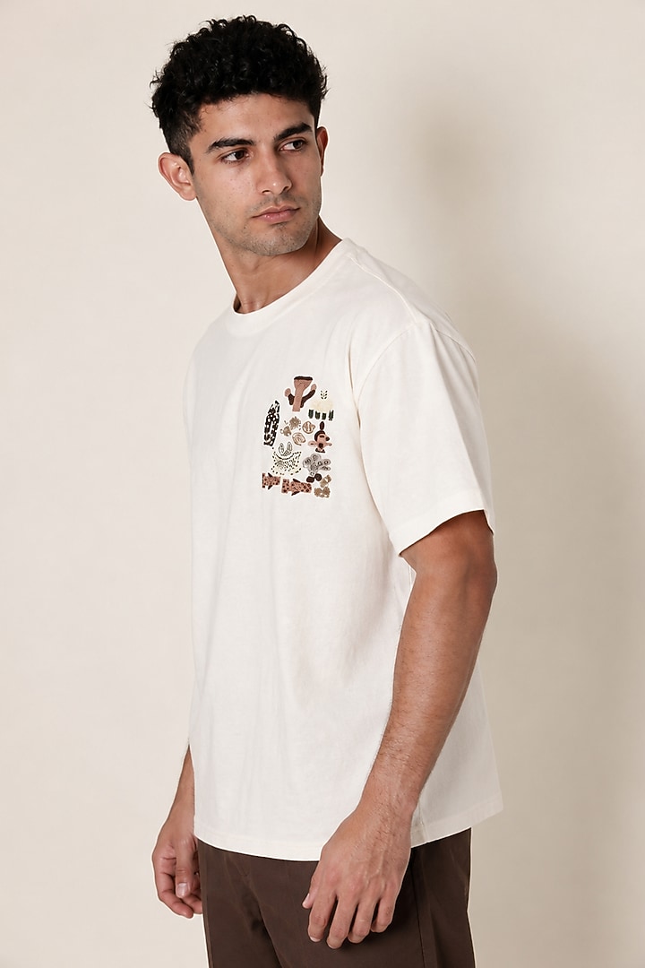 White Knit Fabric Hand Embroidered T-Shirt by Arya Giri Men at Pernia's Pop Up Shop