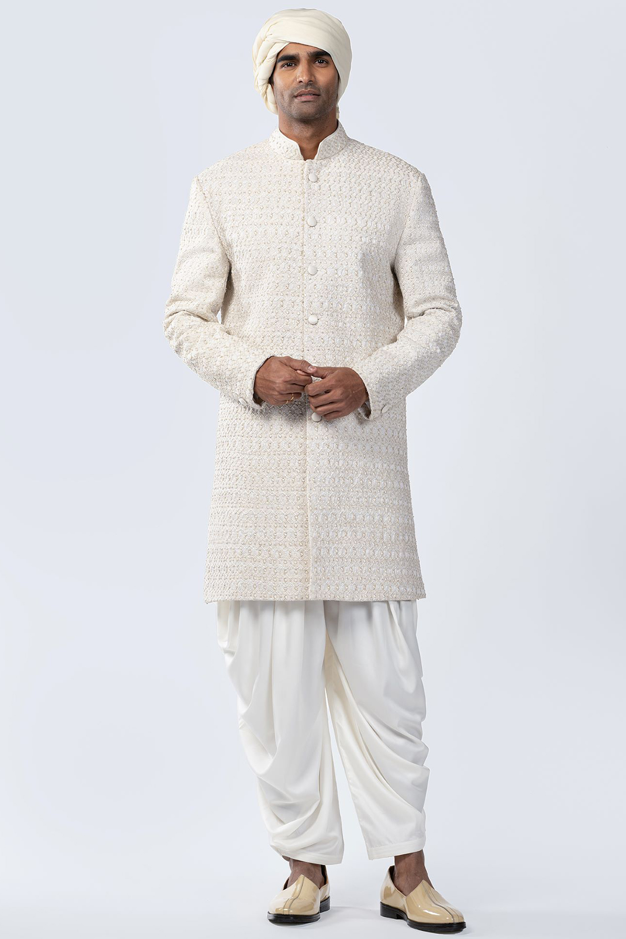 Ivory Silk Thread Embroidered Sherwani Set by Arjuun Kilachand