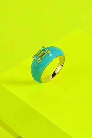 Gold Finish Blue Topaz Ring In Sterling Silver by ARVINO