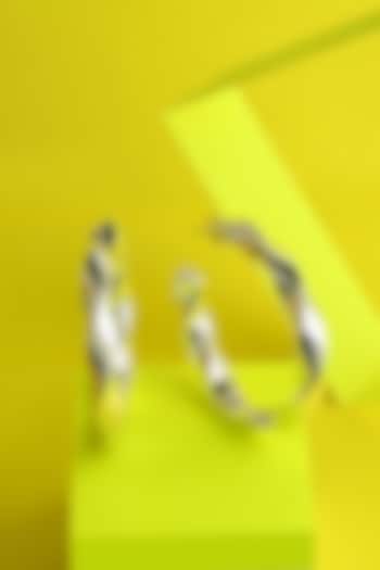 White Finish Swivel Hoop Earrings In Sterling Silver by ARVINO at Pernia's Pop Up Shop