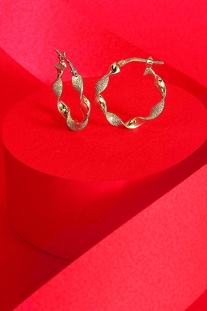 Gold Finish Twisted Hoop Earrings In Sterling Silver by ARVINO at Pernia's Pop Up Shop