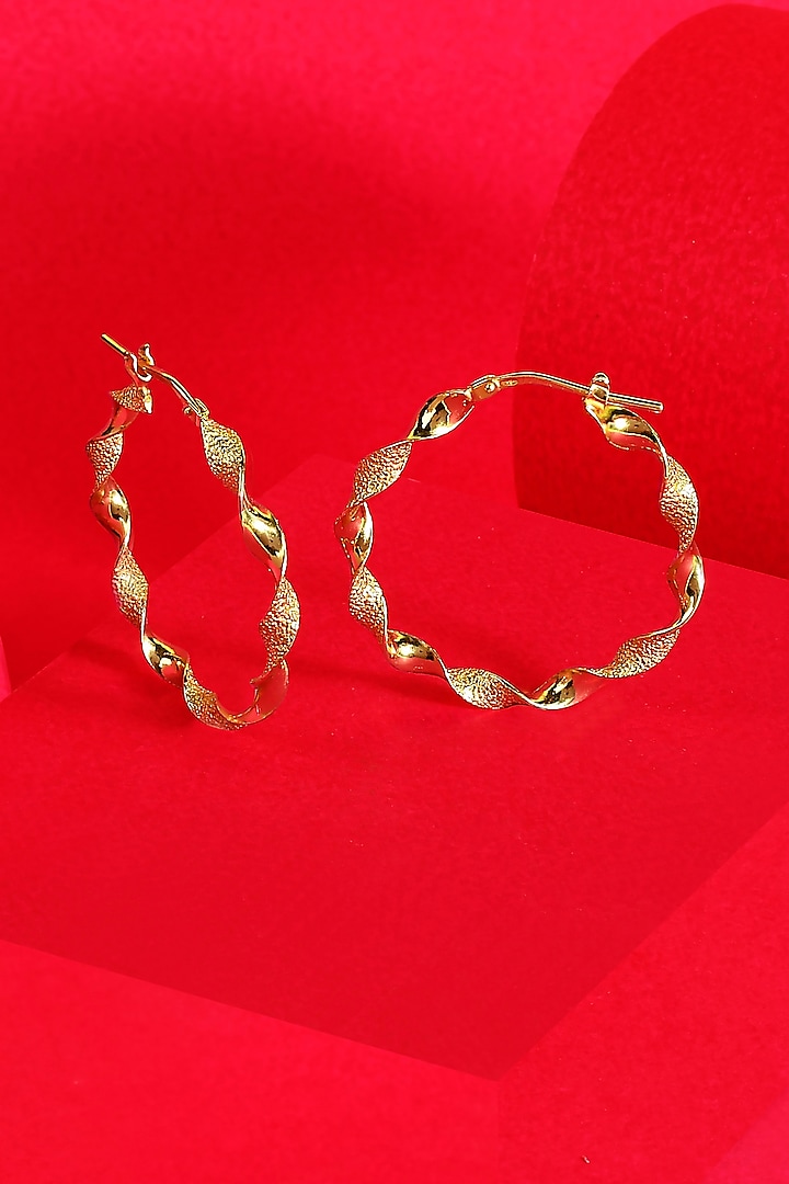 Gold Finish Twisted Hoop Earrings In Sterling Silver by ARVINO