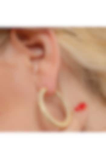 Gold Finish Cubic Zirconia Hoop Earrings by ARVINO at Pernia's Pop Up Shop