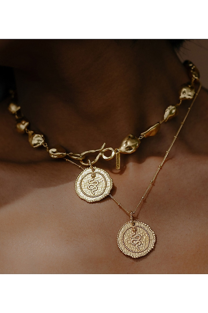 Gold Finish Snake Embossed Coin Charm by Arvino at Pernia's Pop Up Shop