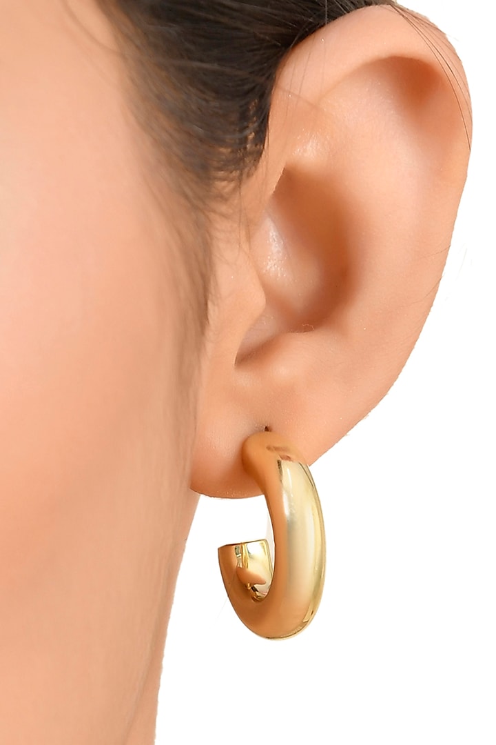 Gold Finish Medium Hoop Earrings by ARVINO at Pernia's Pop Up Shop