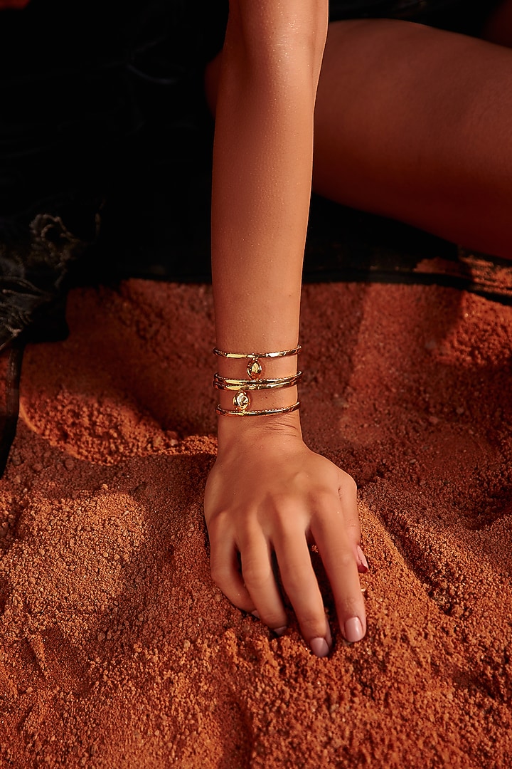 Gold Plated Zircon Kinetic Medallion Cuff by Arqa at Pernia's Pop Up Shop