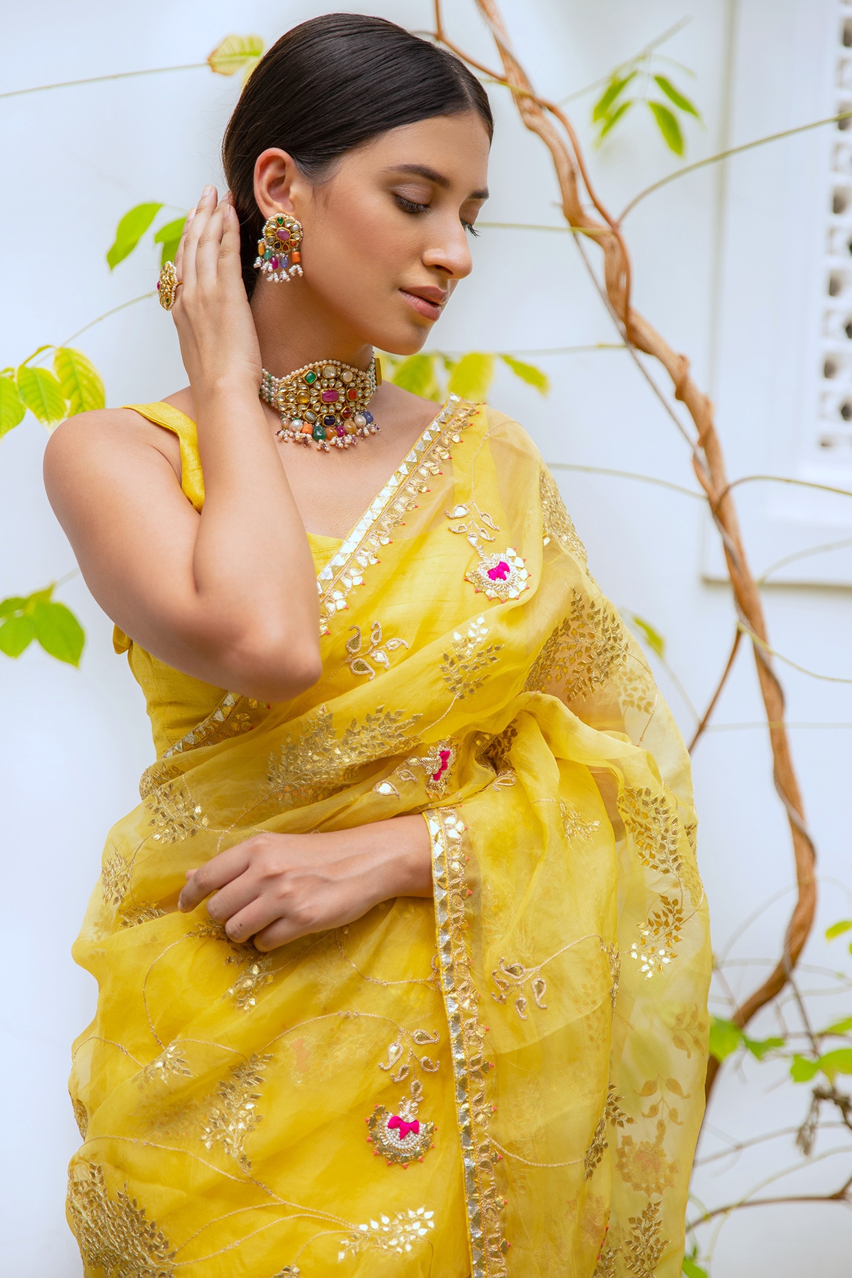 Free Photos - A South Asian Woman Wearing Traditional Attire, Likely A Saree,  And A Yellow Blouse. She Is Adorned With Gold Jewelry, Showcasing The  Beauty Of Her Culture And Heritage. The
