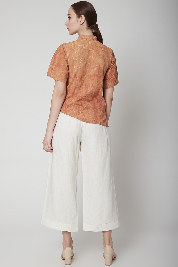 White Flared Pants With Pockets by AURUHFY at Pernia's Pop Up Shop