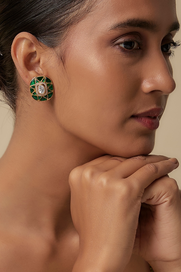 Gold Finish Uncut Zircon & Synthetic Emerald Stud Earrings by Aryah Jewels at Pernia's Pop Up Shop